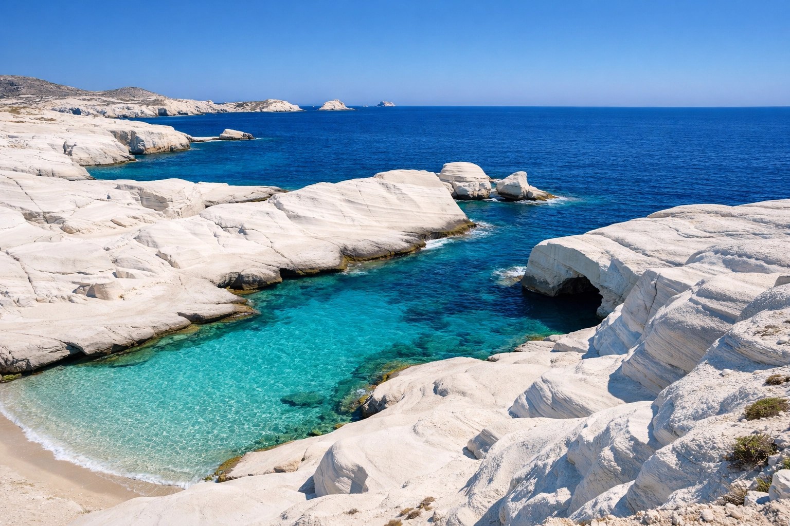 White volcanic rocks and turquoise water at Sarakiniko Beach, Milos, a top hidden gem for 2026 Greece travel.