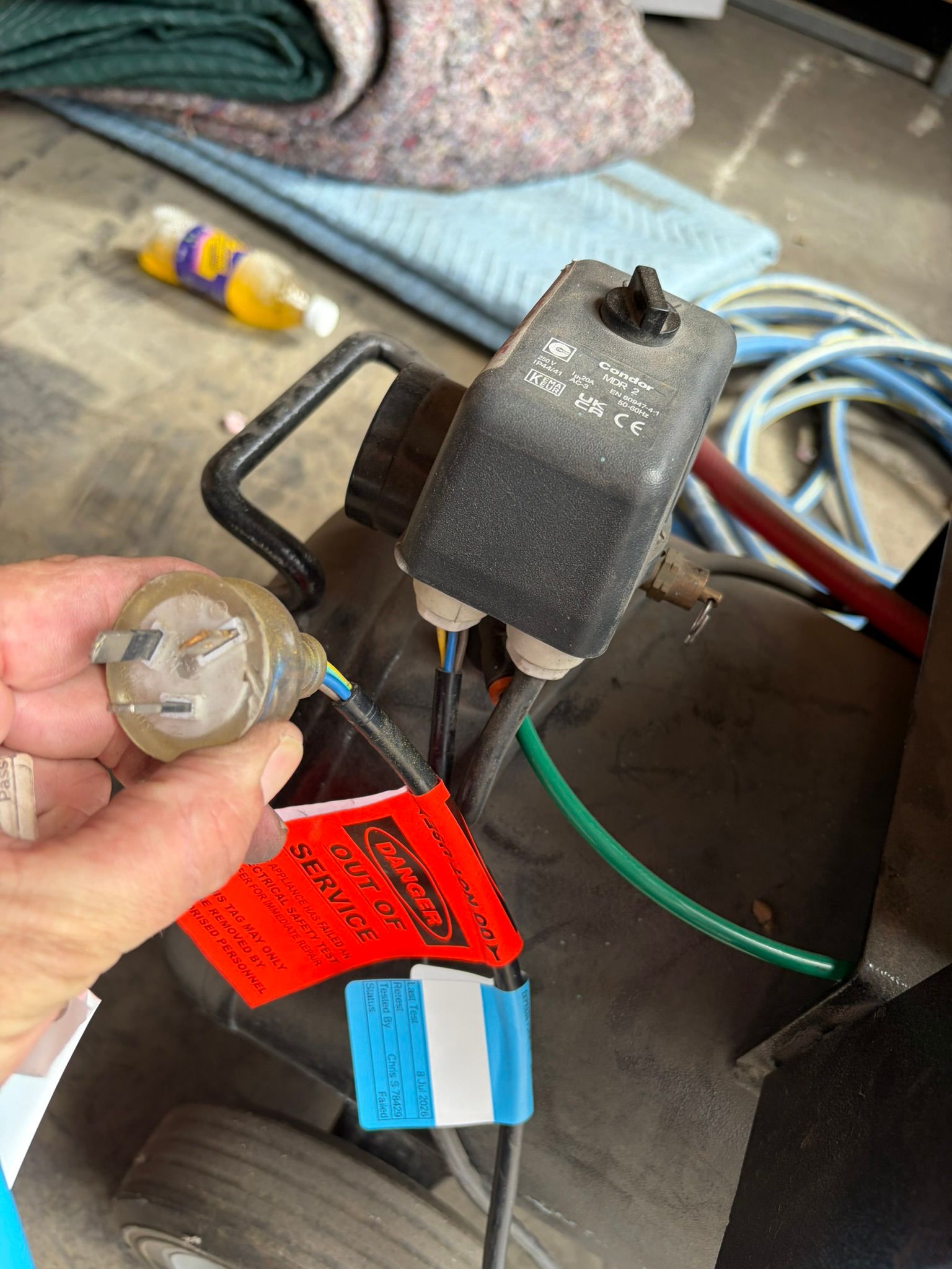 Condor pressure switch marked out of service during an electrical safety inspection of failed workplace equipment