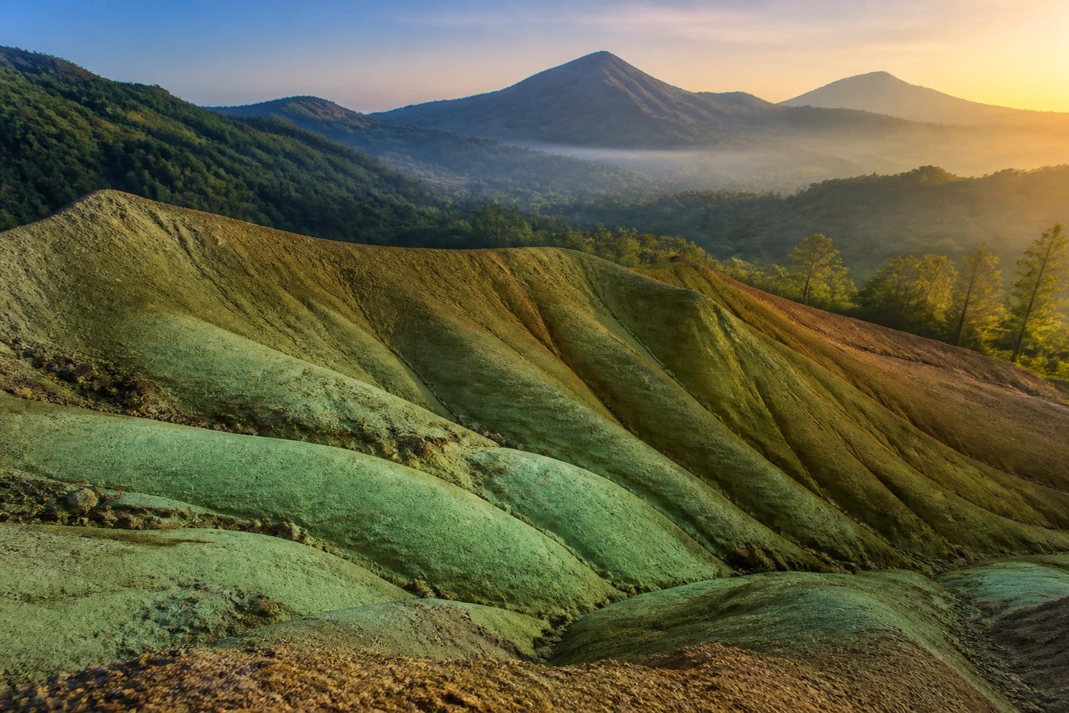 Natural mineral deposit of French green clay in the Auvergne region under soft morning light.