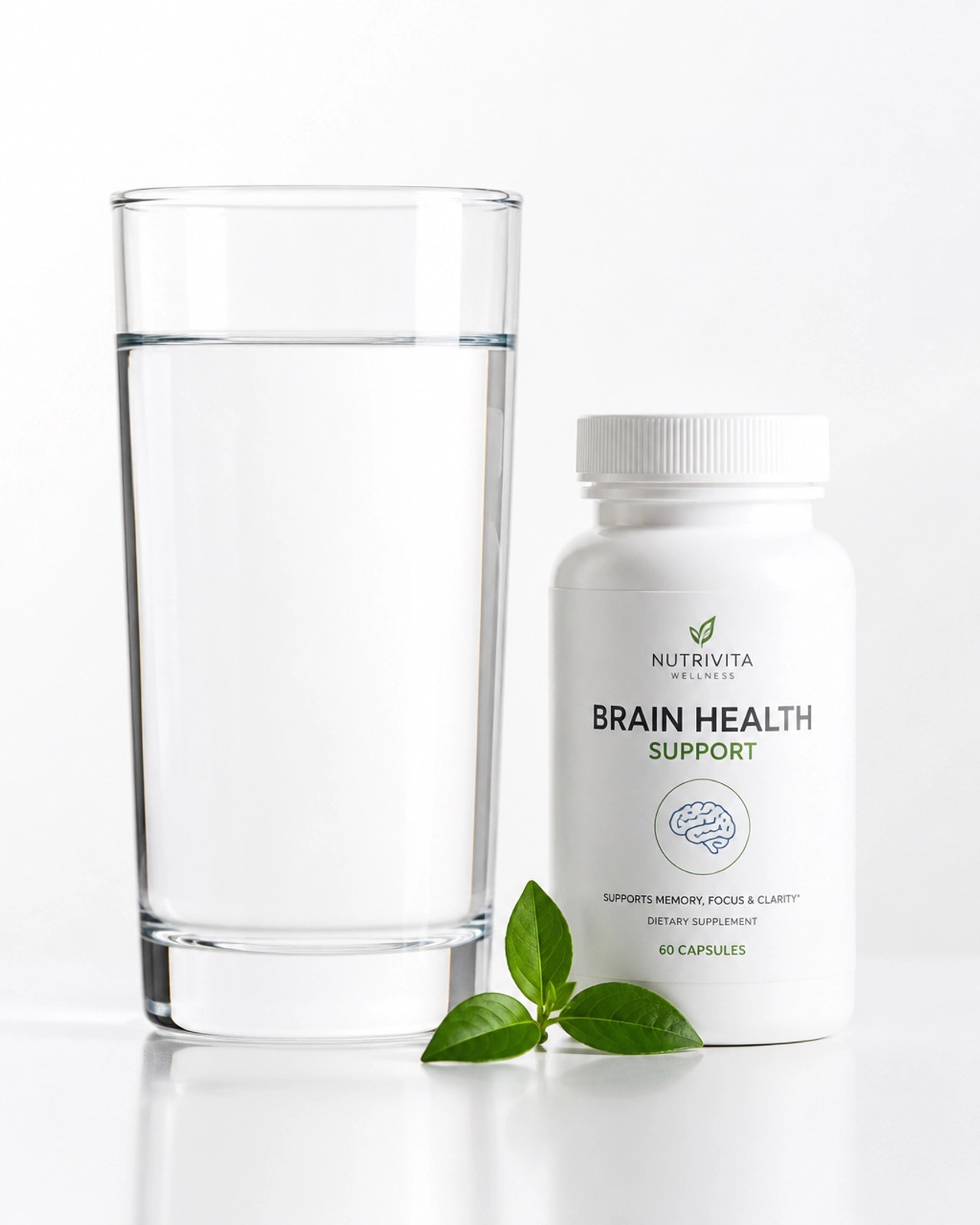 White capsule bottle and a green leaf on a white background symbolizing natural wellness
