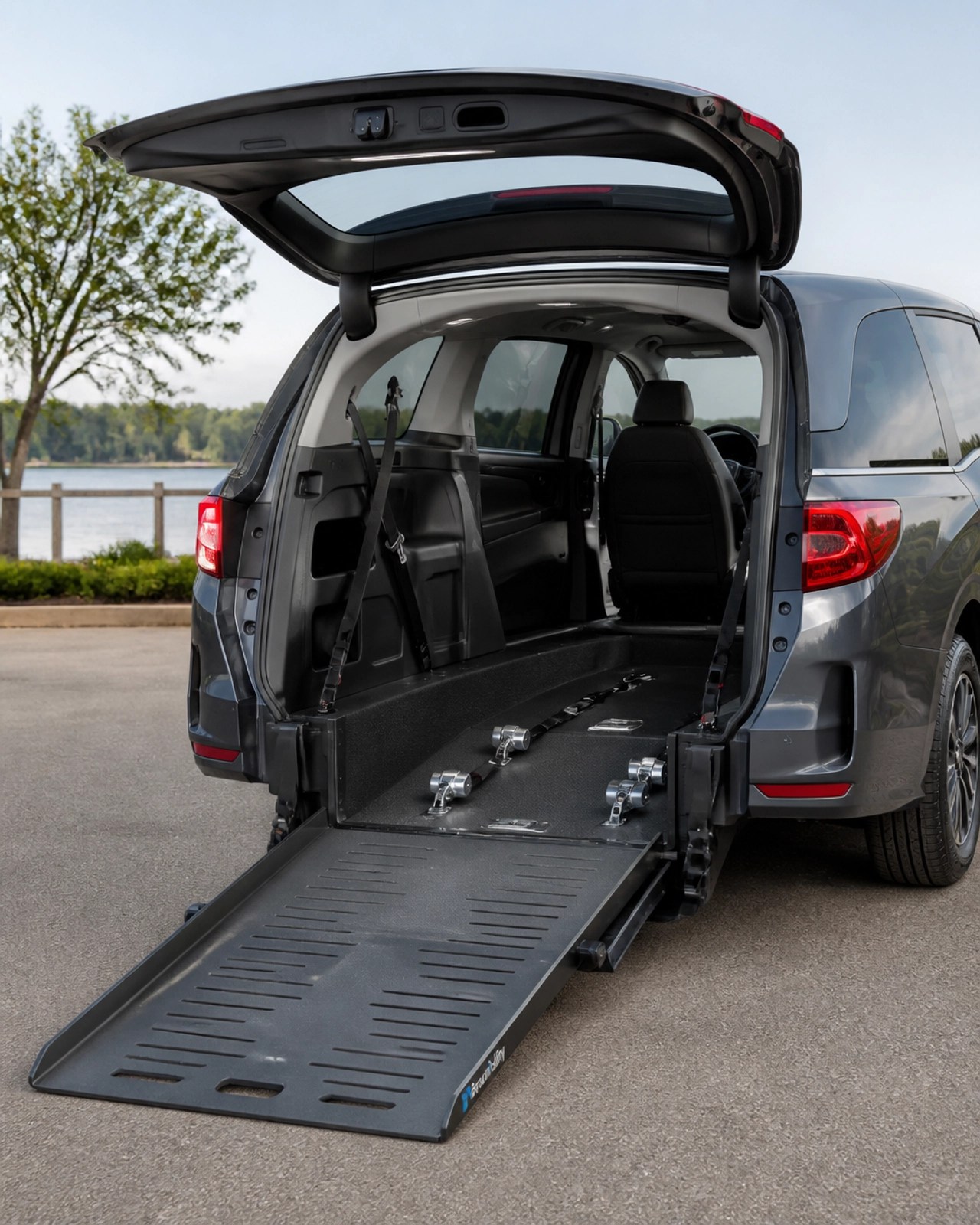 A modern wheelchair-accessible van with a sturdy ramp and safety tie-downs