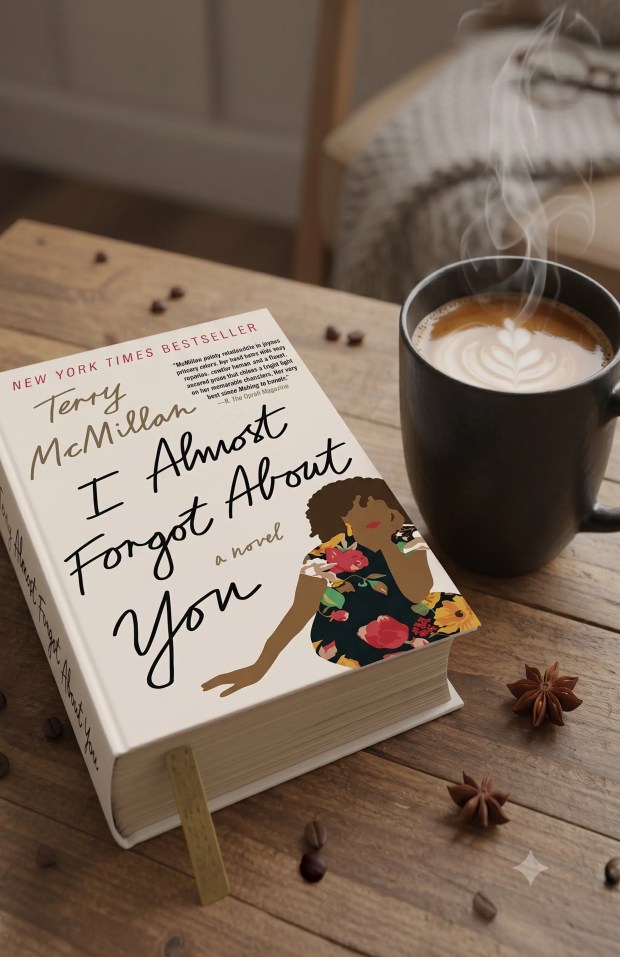 Book and latte on wooden table