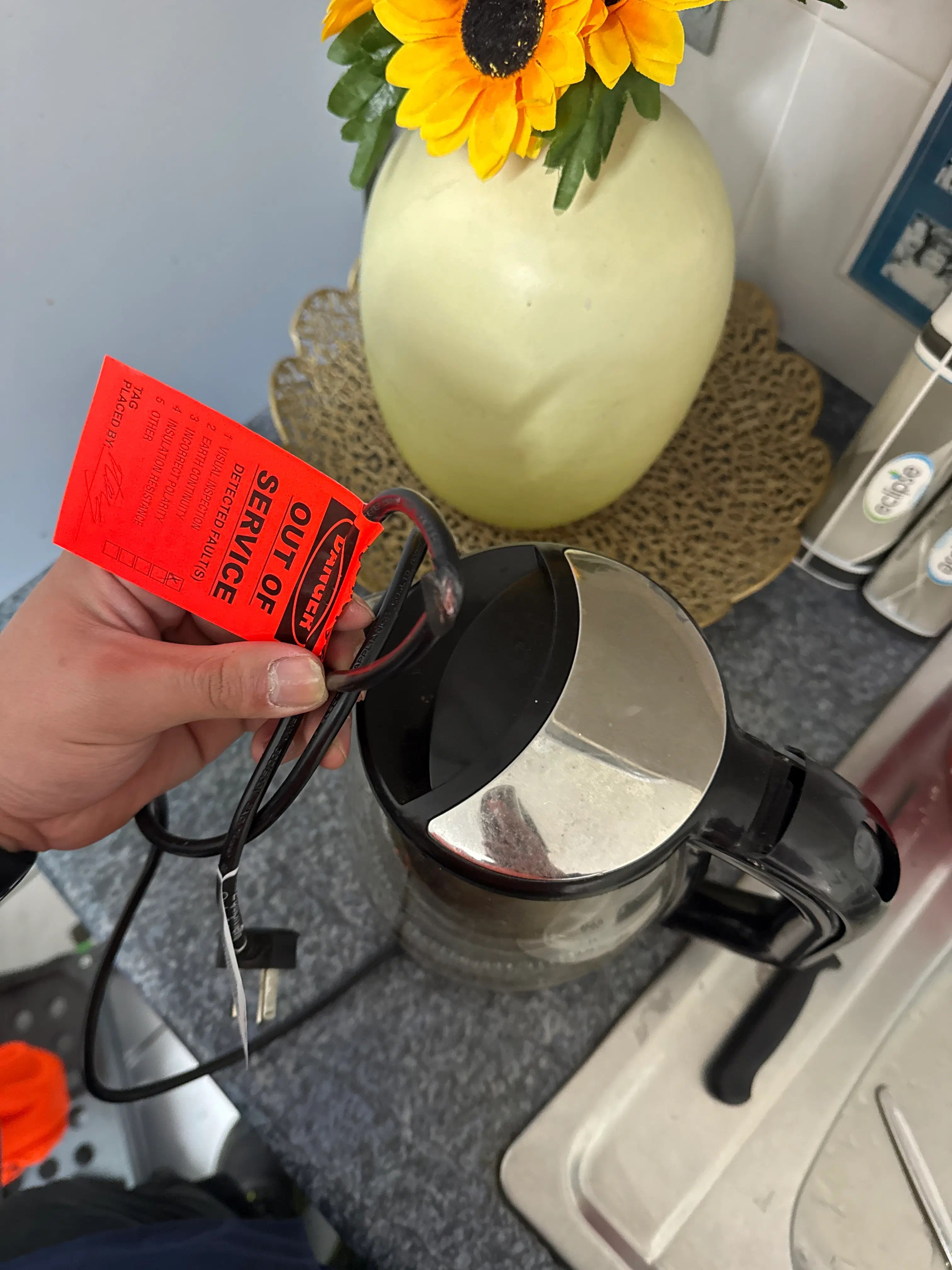 Portable kettle marked out of service after failing workplace electrical safety inspection