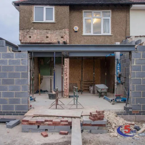 A rear home extension in progress, showing structural steel beams and blockwork, demonstrating C5ive's methodical and safe execution.
