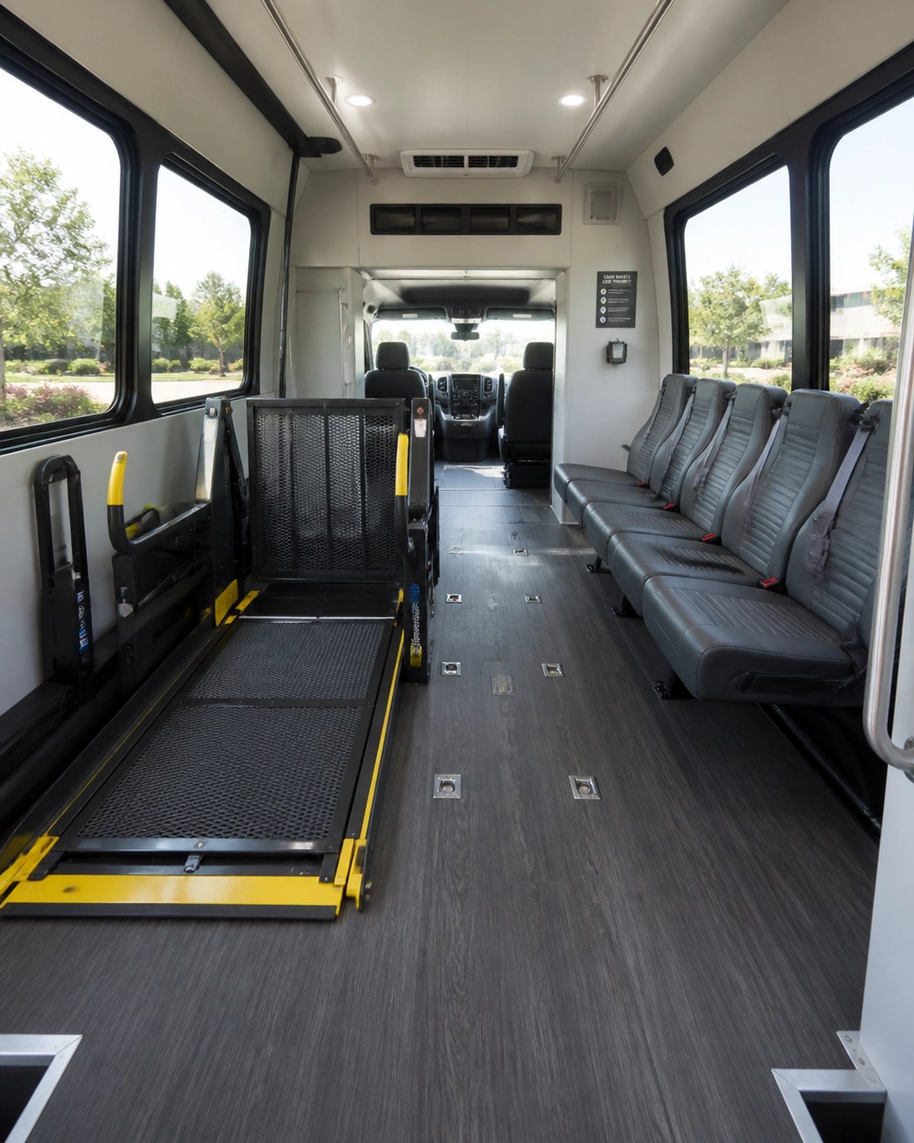 The interior of a modern NEMT vehicle with a wheelchair lift area