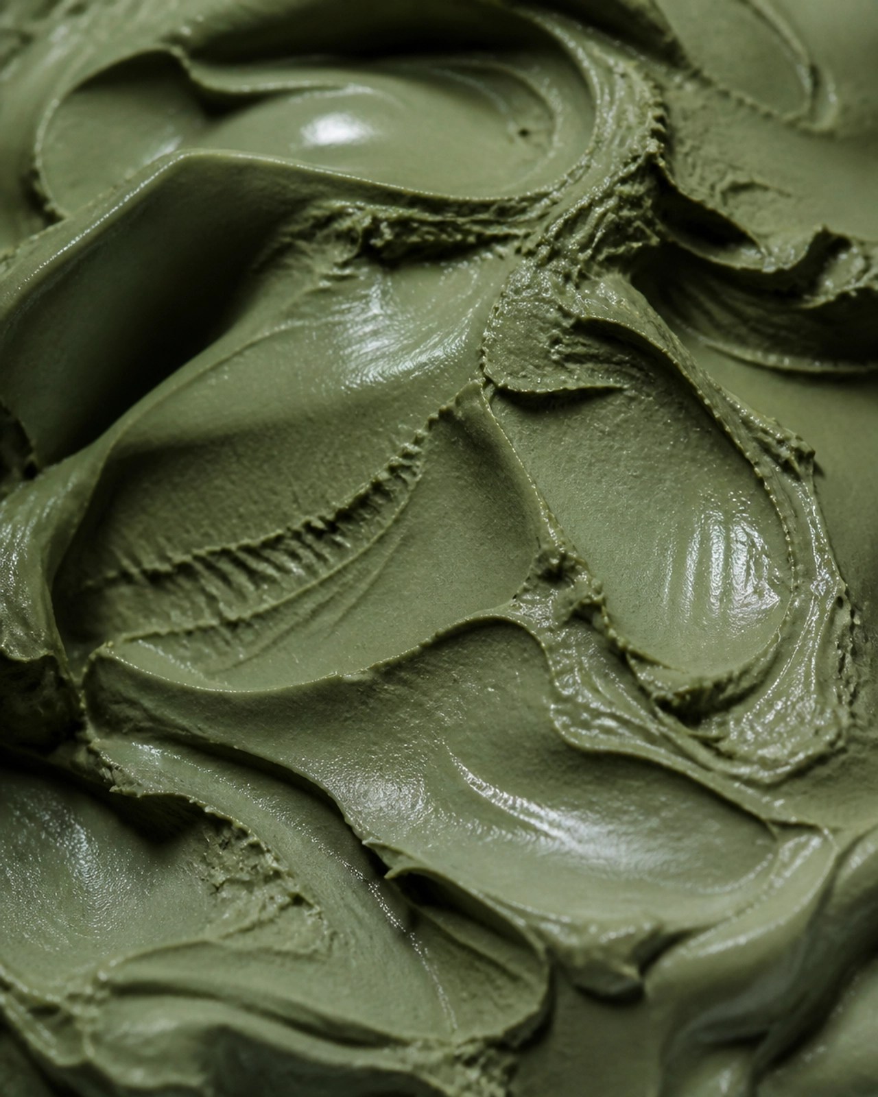 Macro view of smooth, rich French green clay texture