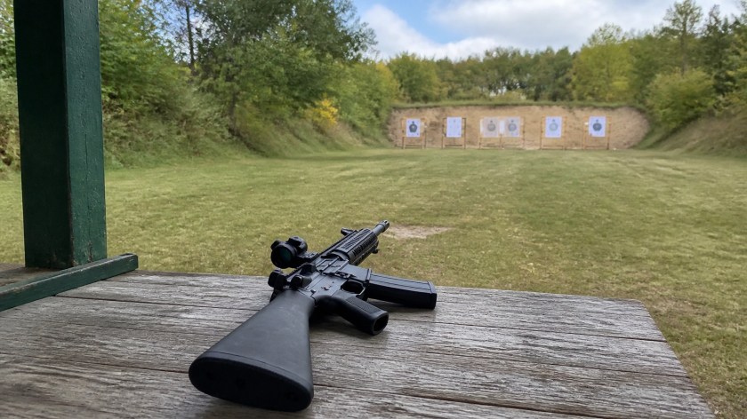 Safe firearm handling at a shooting range bench