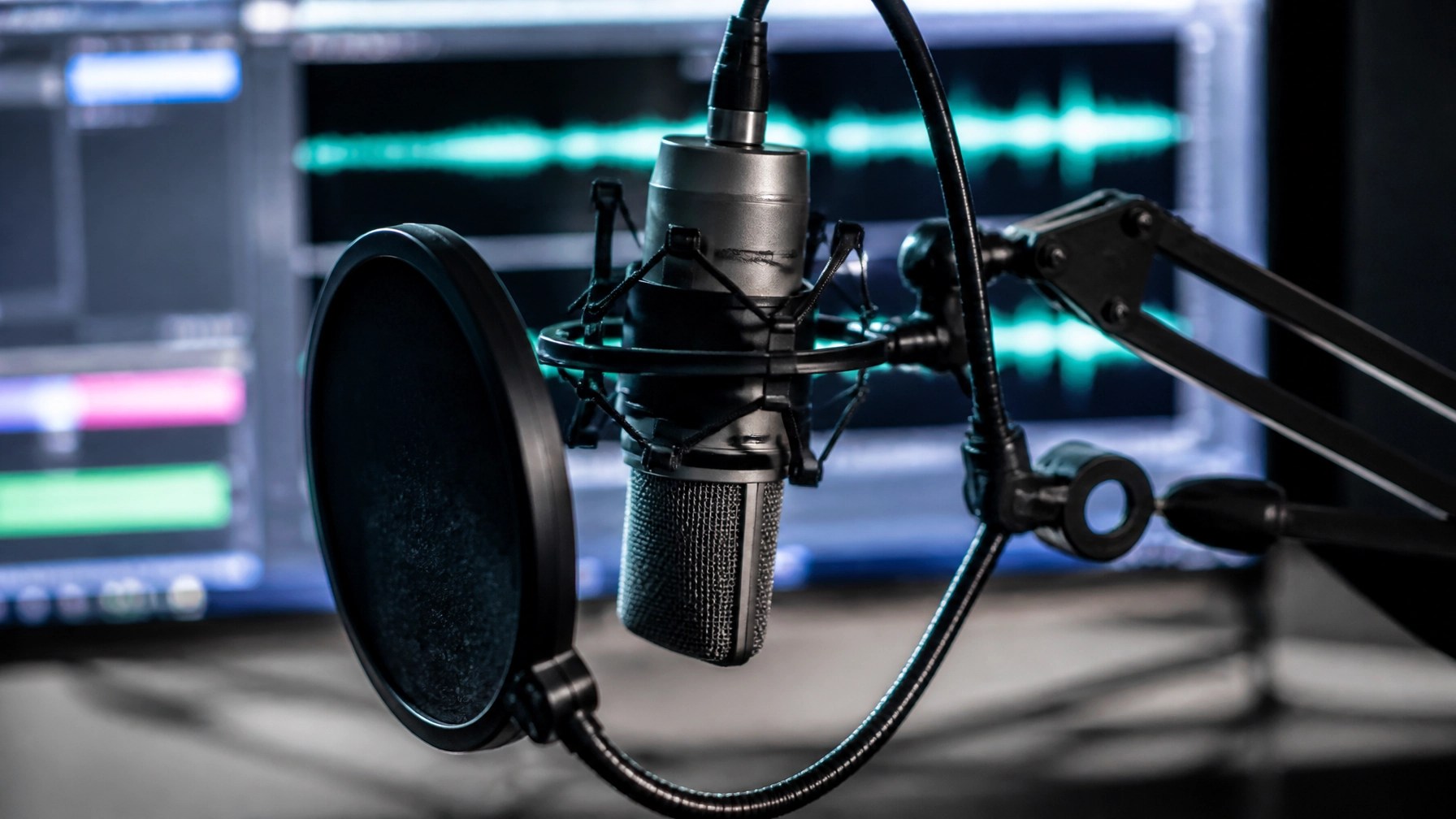 Professional studio microphone on a boom arm with a pop filter