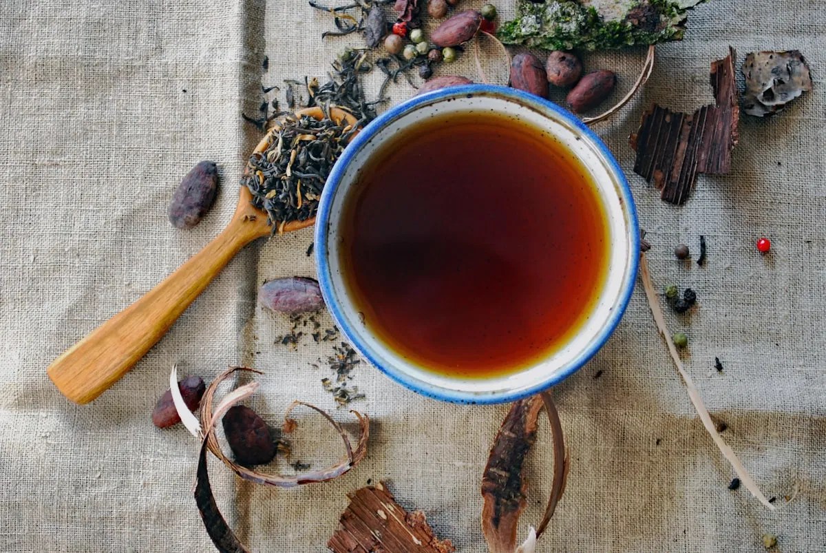 Handcrafted Ayurvedic herbal decoction in a ceramic bowl