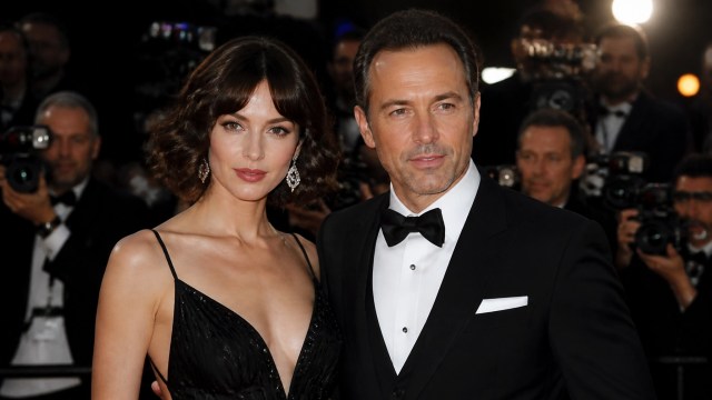 Celebrity-inspired couple at a polished premiere in black eveningwear and tuxedo