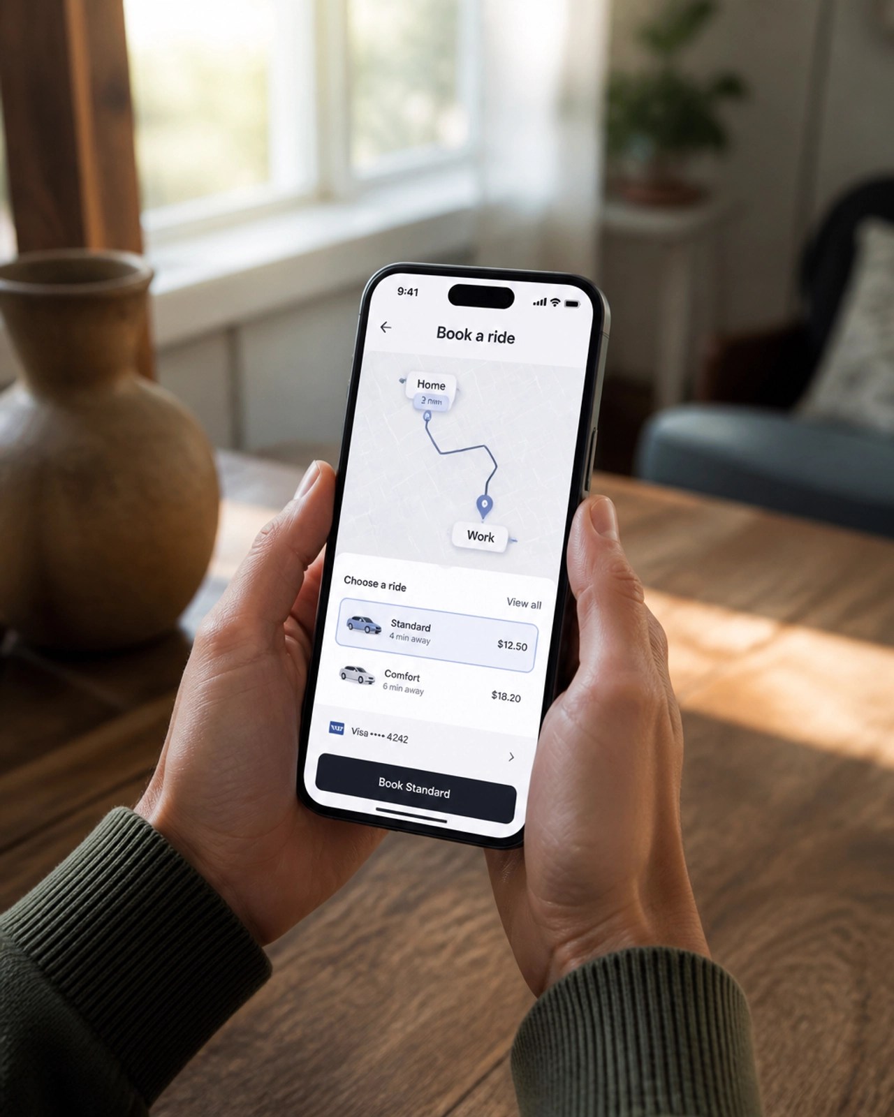 A person using a smartphone to book a ride in a rustic home setting