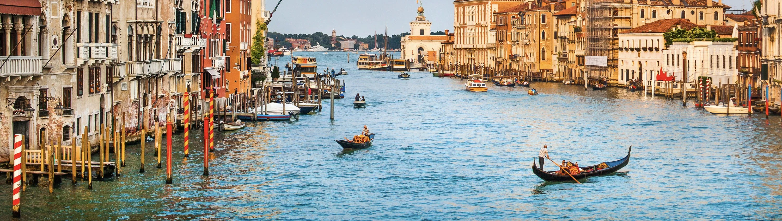 Iconic view of Venice’s Grand Canal with historic buildings and vibrant facades