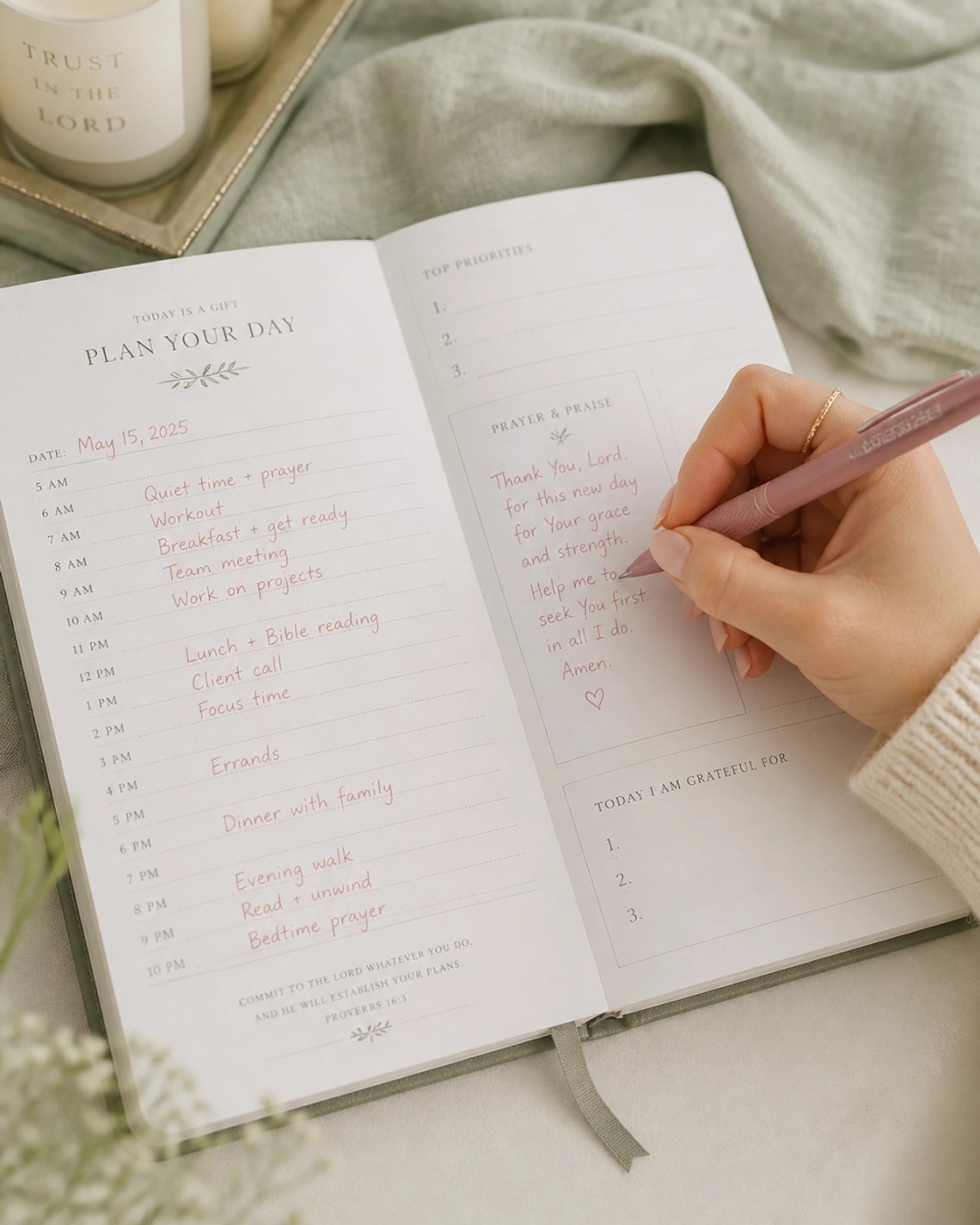 A close-up of a hand writing in a faith-based planner with a rose-gold pen, emphasizing intentionality.