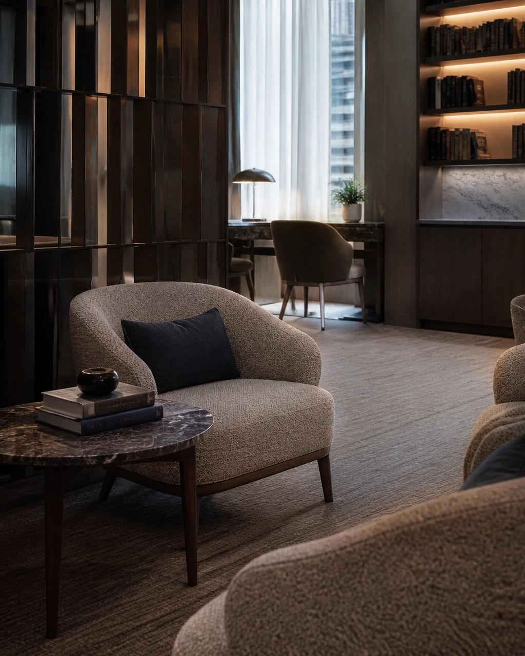Quiet premium hotel lounge with comfortable seating and soft window light