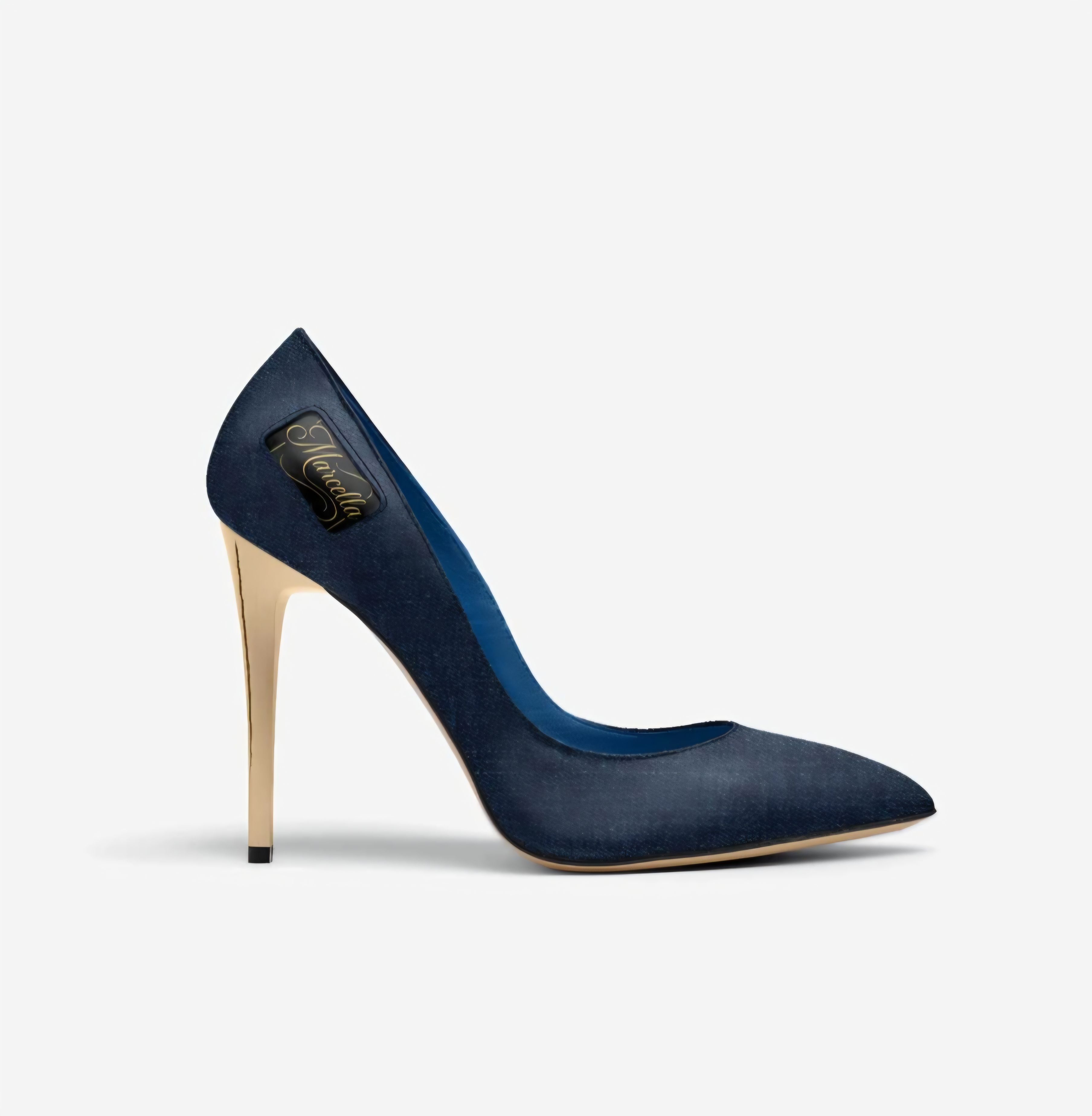 Denim Siren: A high-fashion high-heeled pump made from dark blue denim-textured fabric featuring a sharp gold stiletto heel.