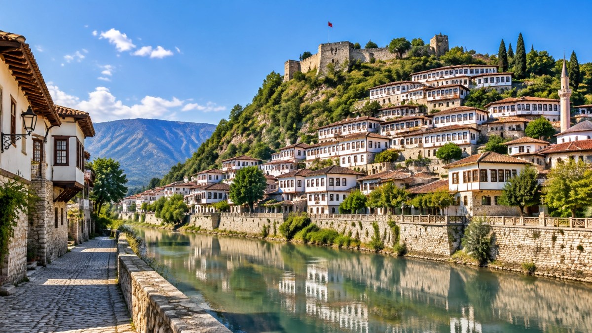 Berat, Albania, with Ottoman houses, castle walls and the Osum River in bright daylight