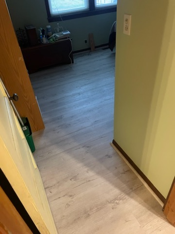 Light-toned Wood-look Laminate Bedroom Flooring