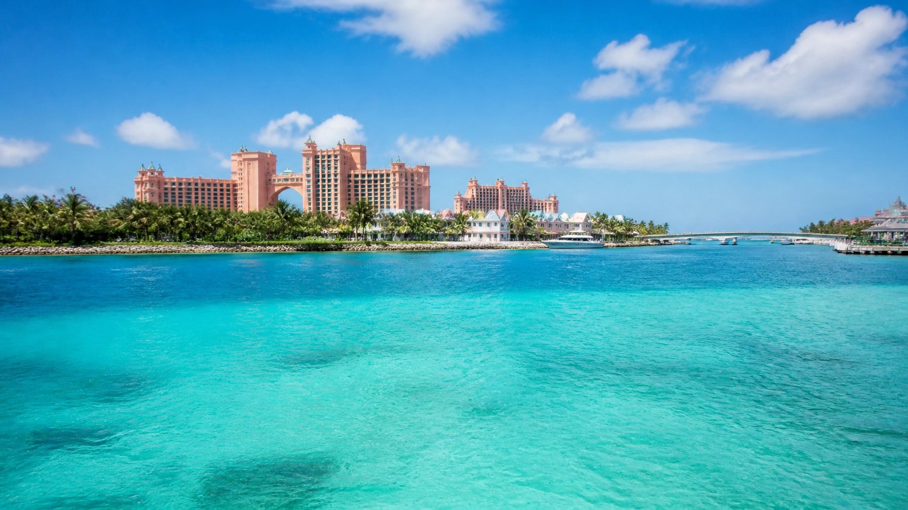 Nassau and Paradise Island skyline with turquoise harbor water and coral-pink resort architecture