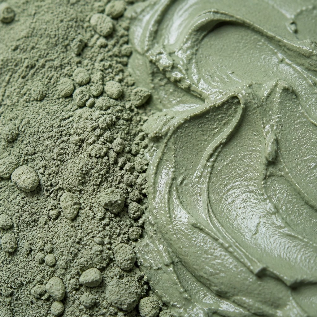 Macro view of green clay texture showing its mineral structure