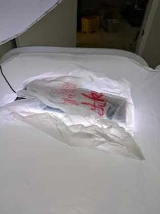 A smartphone protected in bubble wrap, ready for inspection or repair.