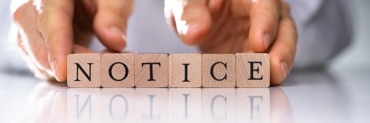 Wooden blocks spelling “NOTICE” represent the importance of accurate eviction documentation
