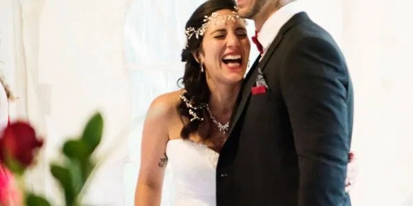 A bride and groom enjoying a joyful moment together