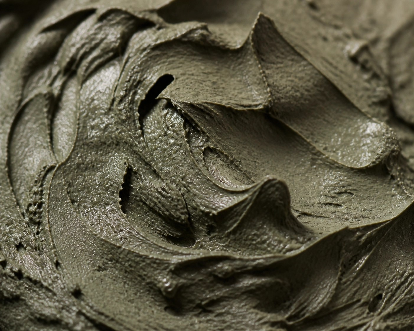 Close-up of nutrient-rich French green clay texture highlighting its complex mineral composition for healing.