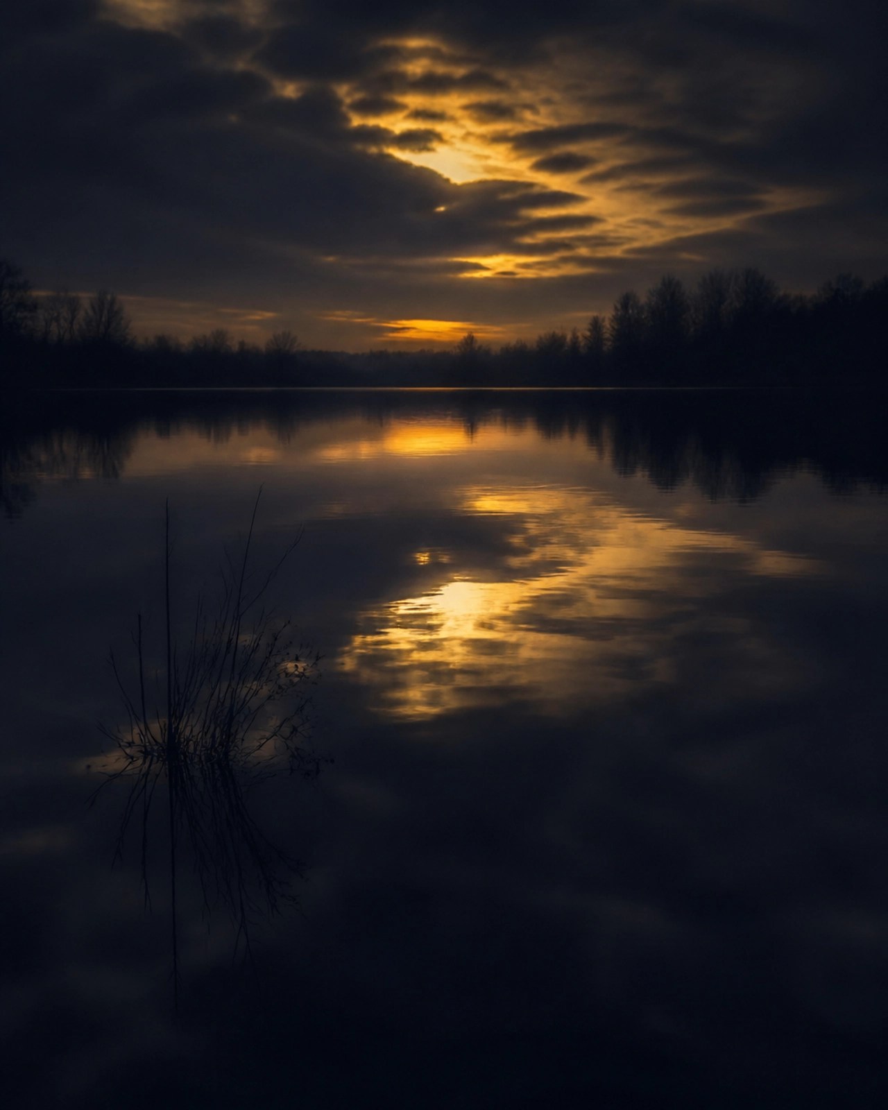 A minimalist, moody shot of a perfectly still, dark indigo pond representing a stagnant soul