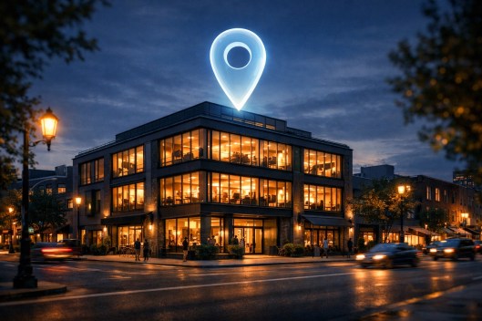 Professional city office building at twilight with a digital location pin for local SEO map ranking.
