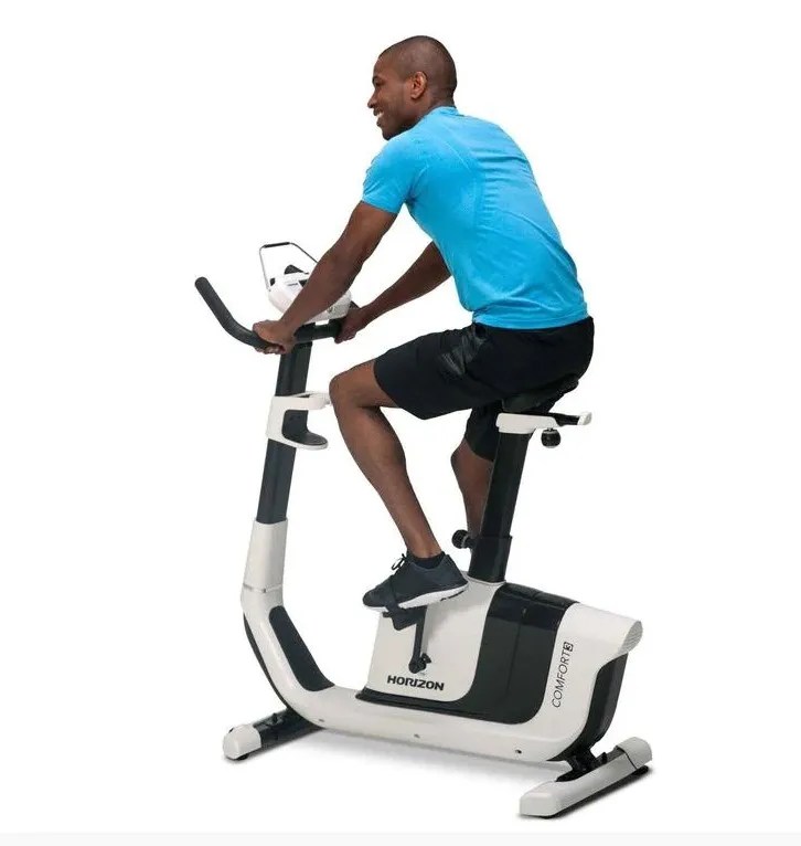 Horizon Comfort 8 upright exercise bike A man in activewear uses this high-quality upright exercise bike, ideal for home fitness. The bike is available for both short and long term rental or purchase through Fitness Hire & Sales.