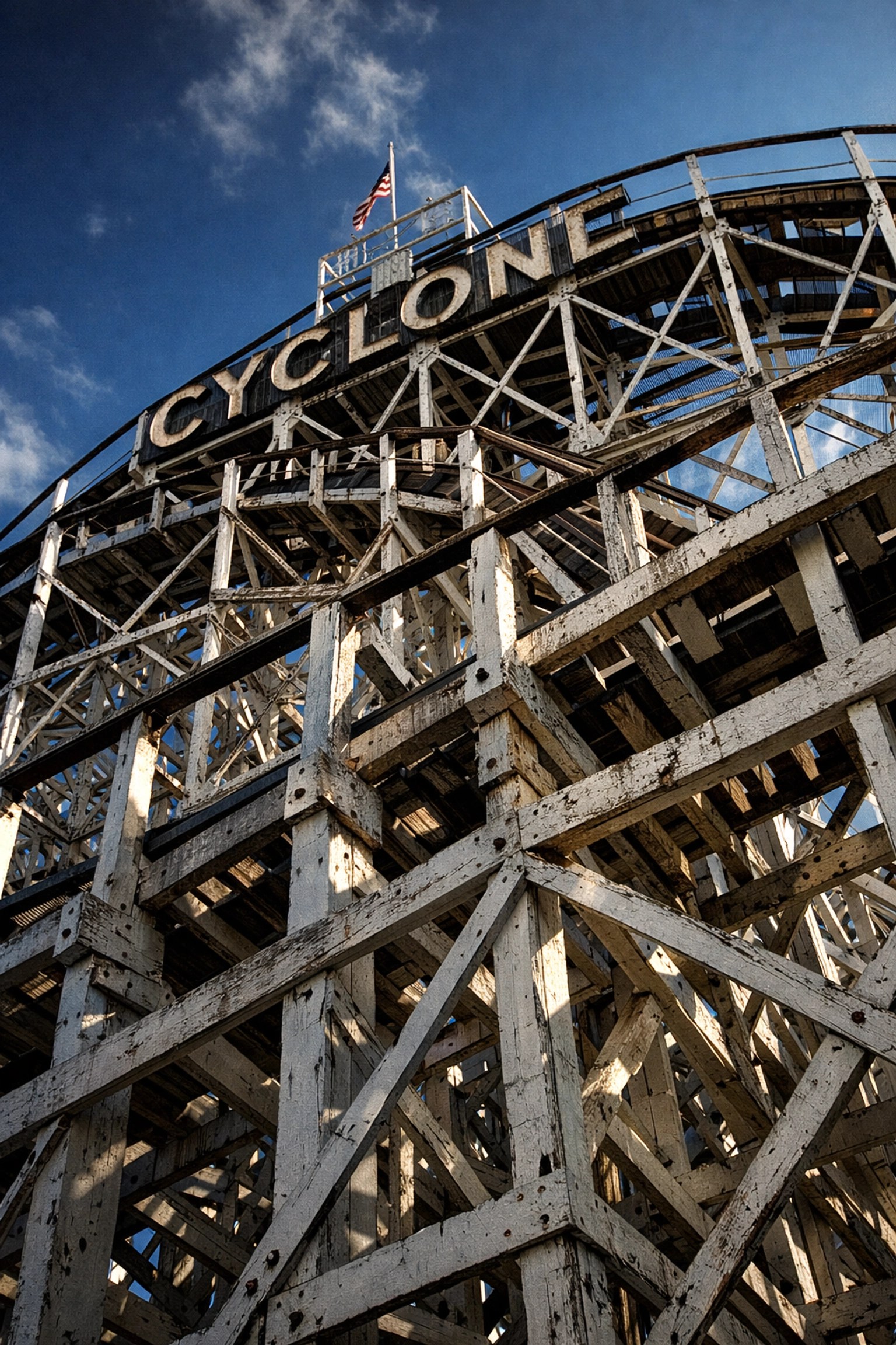 White wooden support beams of the legendary Coney Island Cyclone roller coaster in Brooklyn.