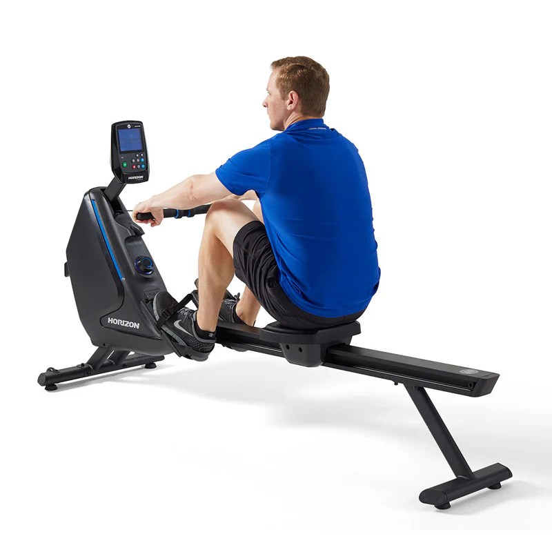 Horizon rowing machine demonstration A man demonstrates the use of a Horizon rowing machine, an effective cardio and full-body workout option available for hire or purchase at Fitness Hire & Sales.
