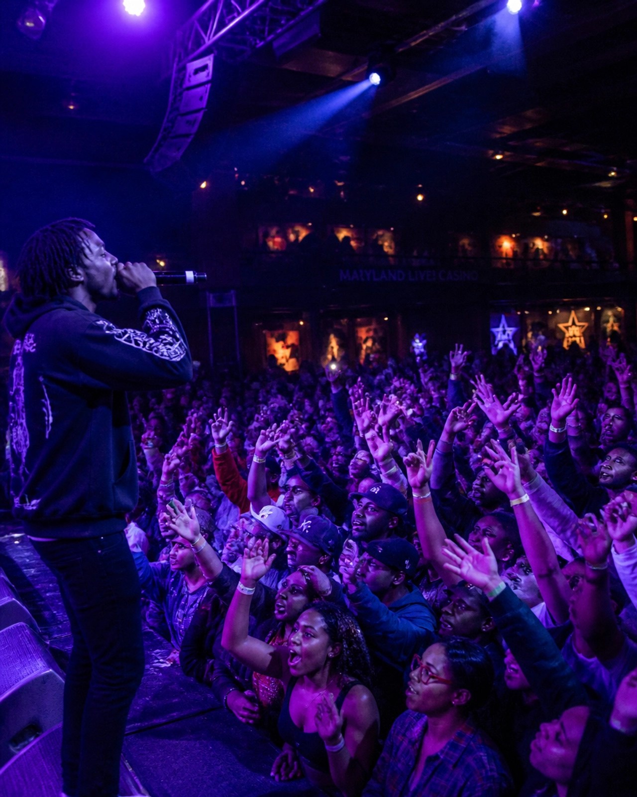 Crowd at a packed hip-hop concert in Maryland showing the energy of dedicated fans