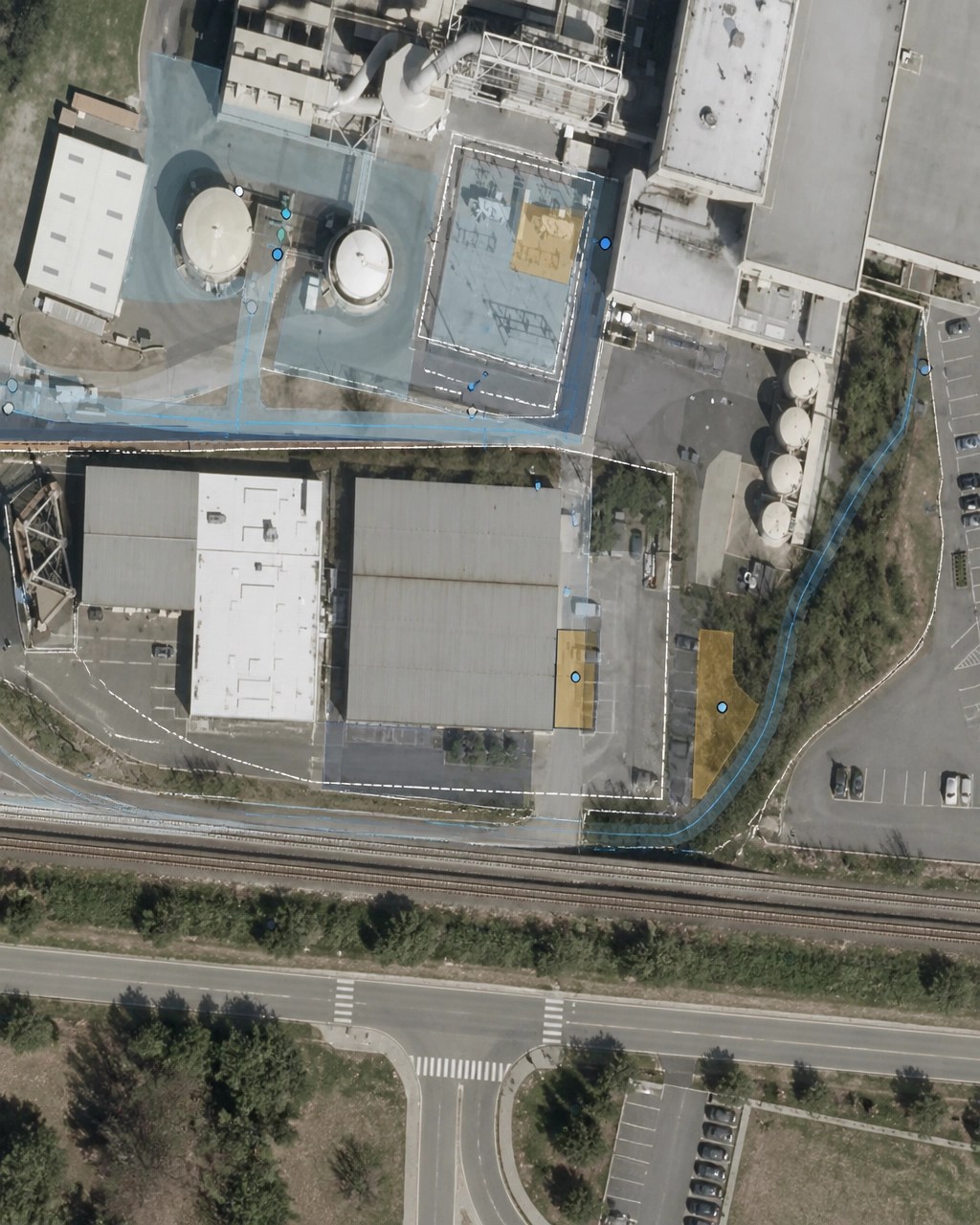 Technical GIS-style site plan showing remediation zones, monitoring points, transit proximity, and future redevelopment areas