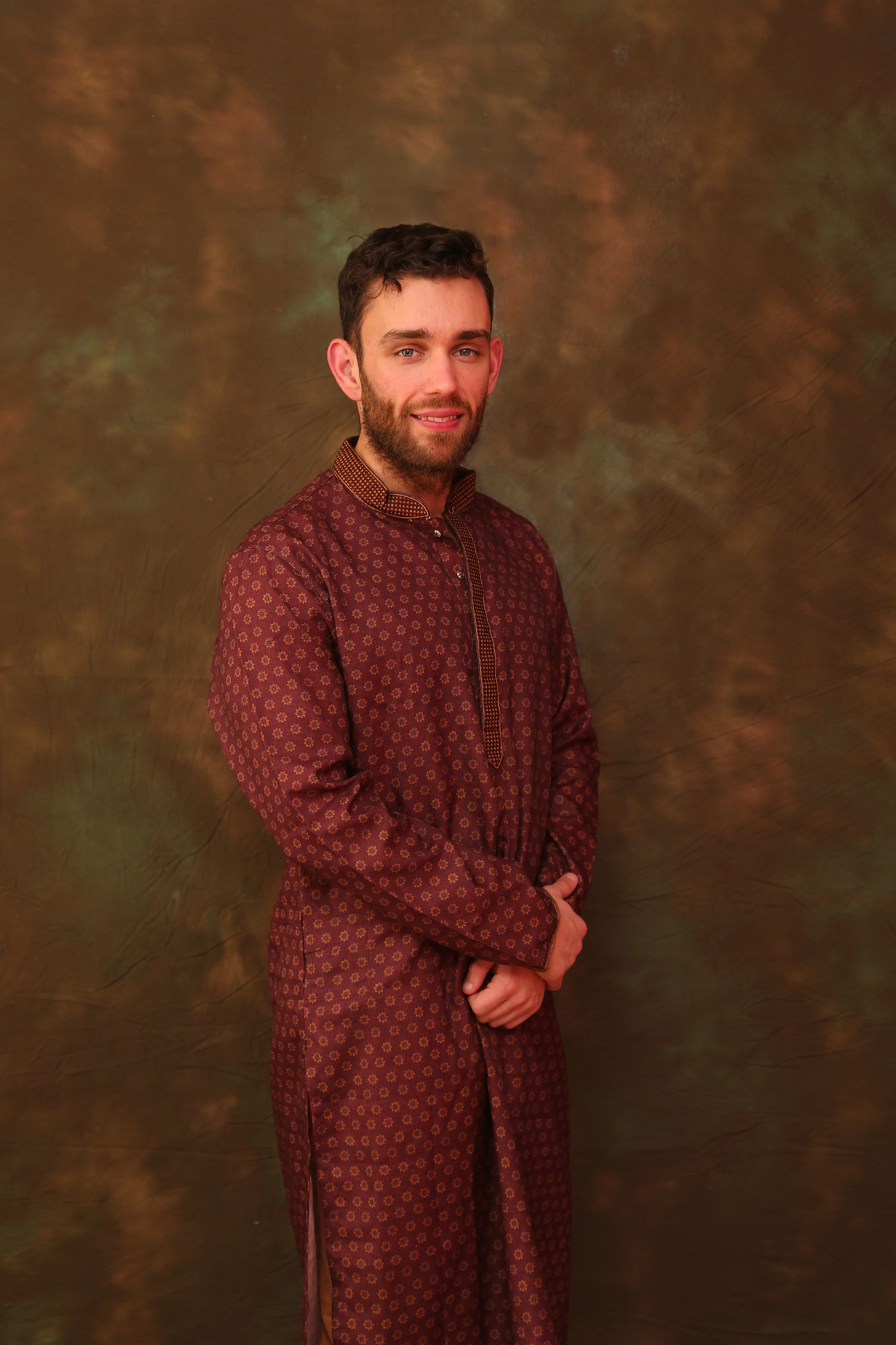 Rob in a formal traditional portrait, adding another polished look to the story of their versatility.