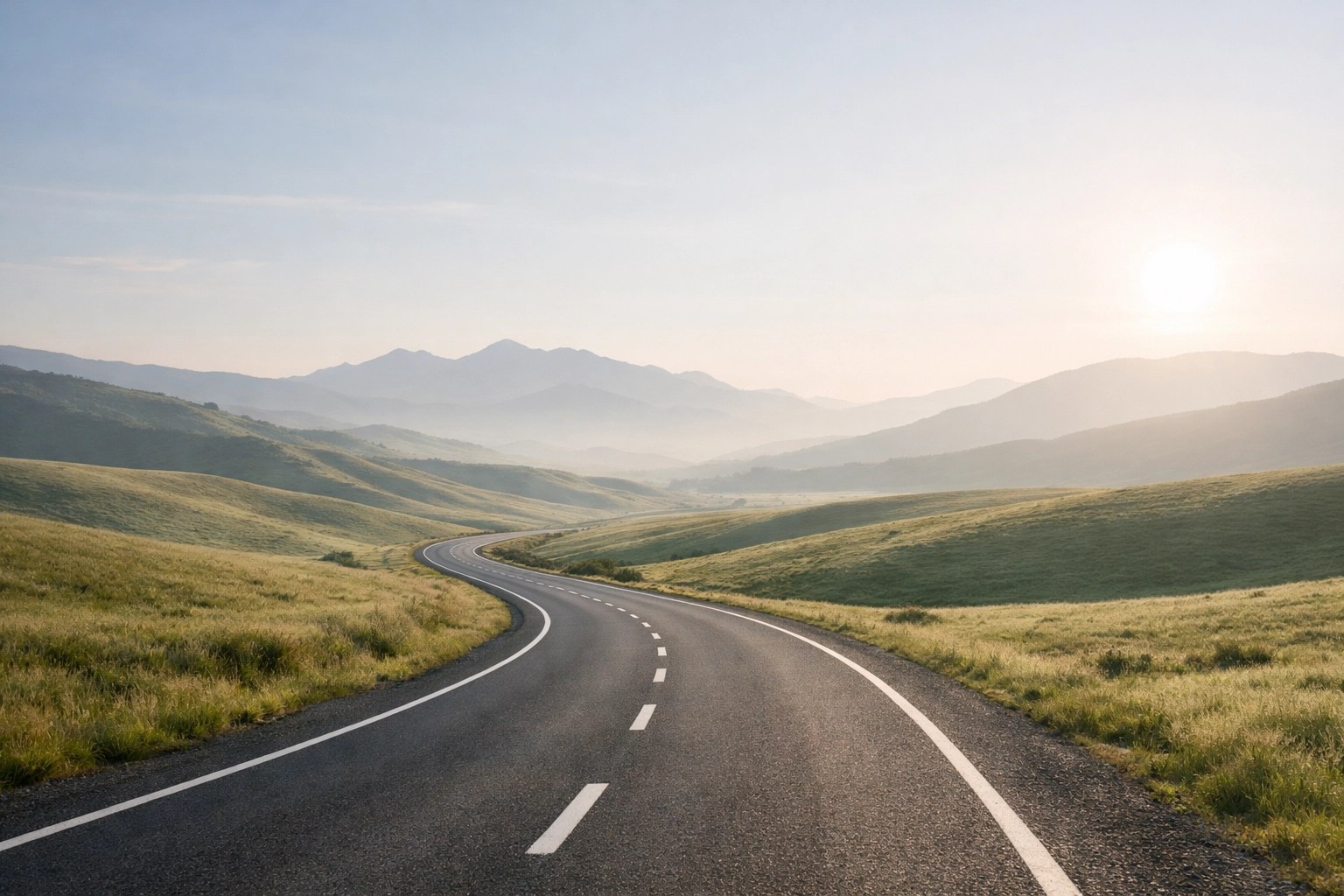 Quiet road through a remote rural landscape representing barriers to healthcare access.