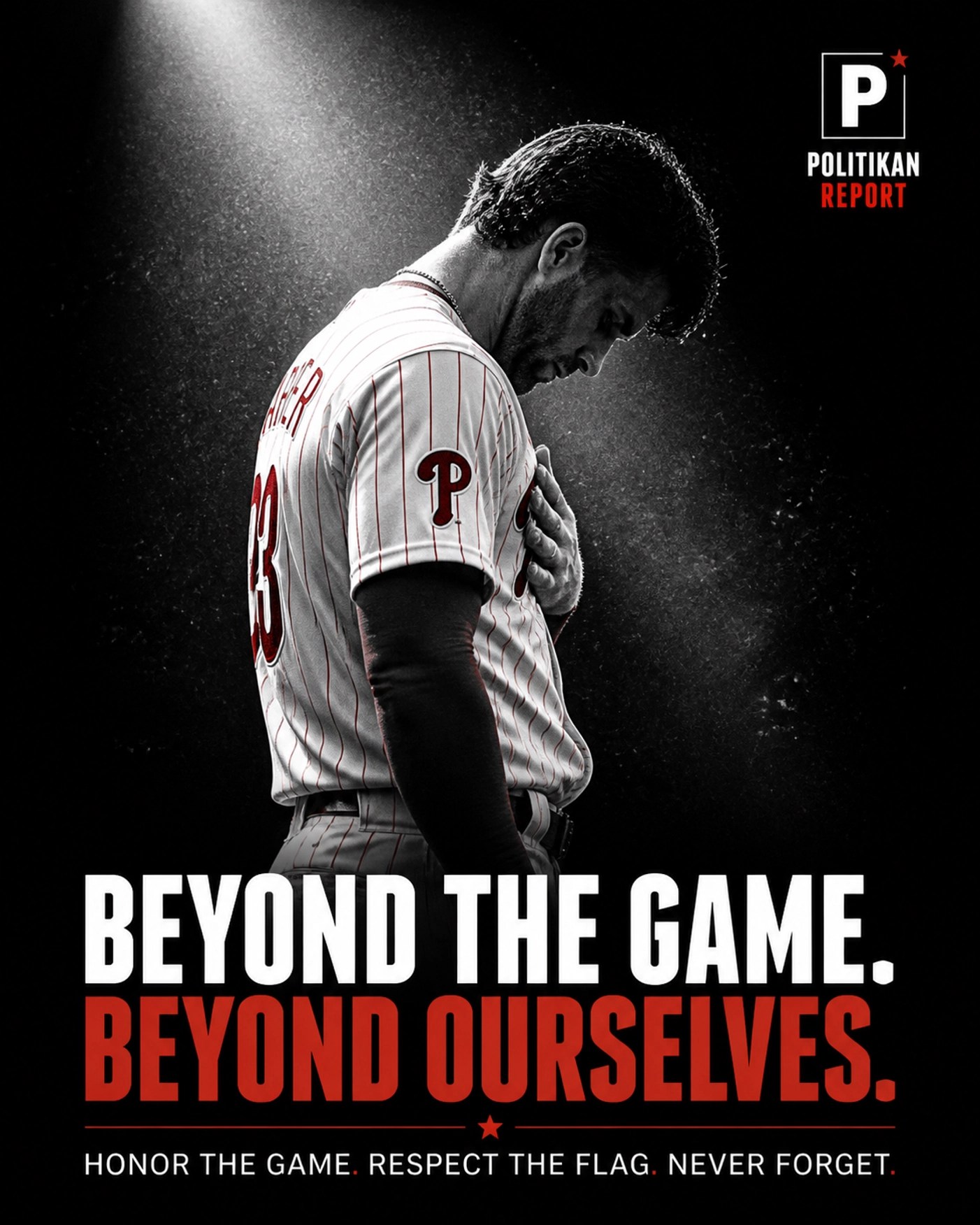 Baseball player in white and red uniform bowing his head under a spotlight during an emotional sports tribute.