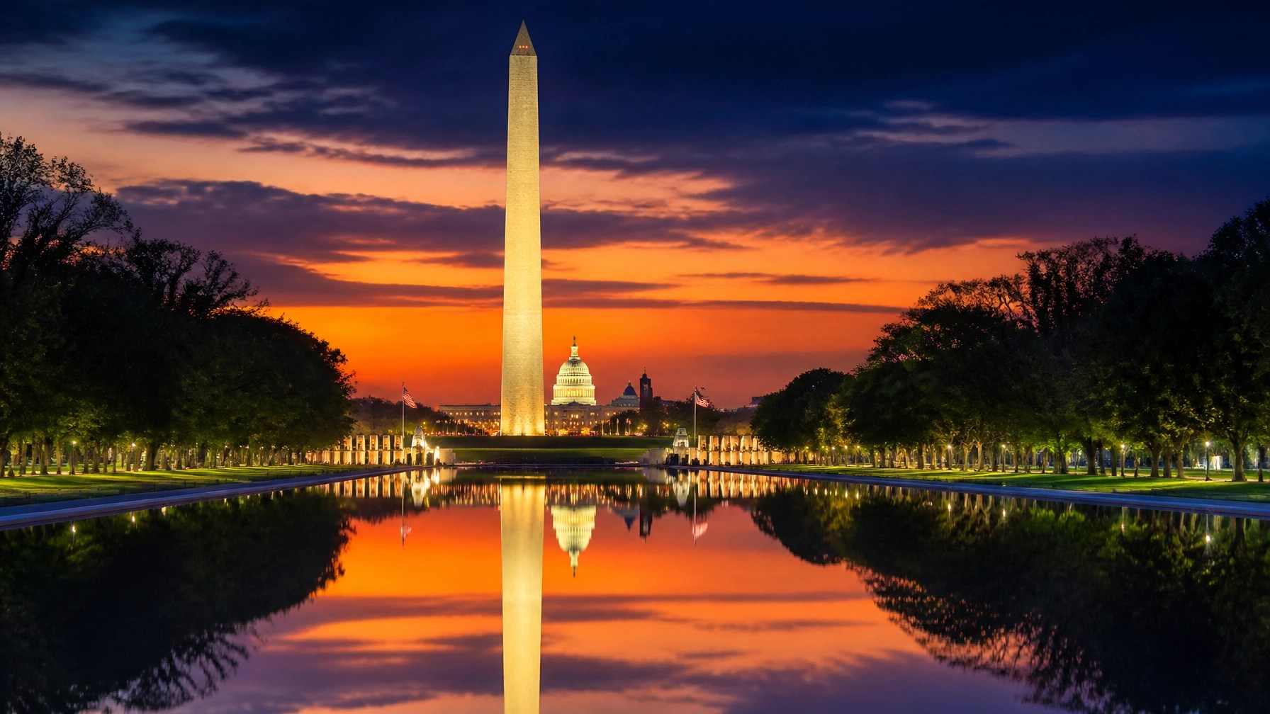 A stunning view of the Washington D.C. skyline at dusk, featuring the illuminated Washington Monument and U.S. Capitol dome.