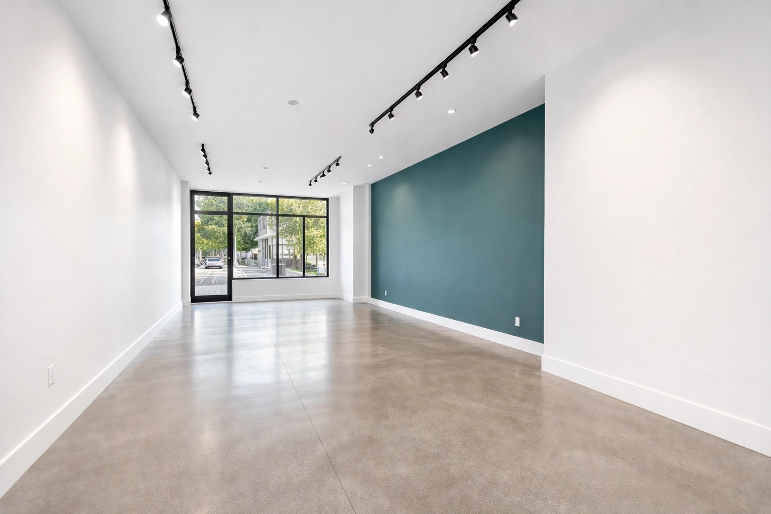 Retail store interior in Port St. Lucie featuring clean white and teal walls after professional painting