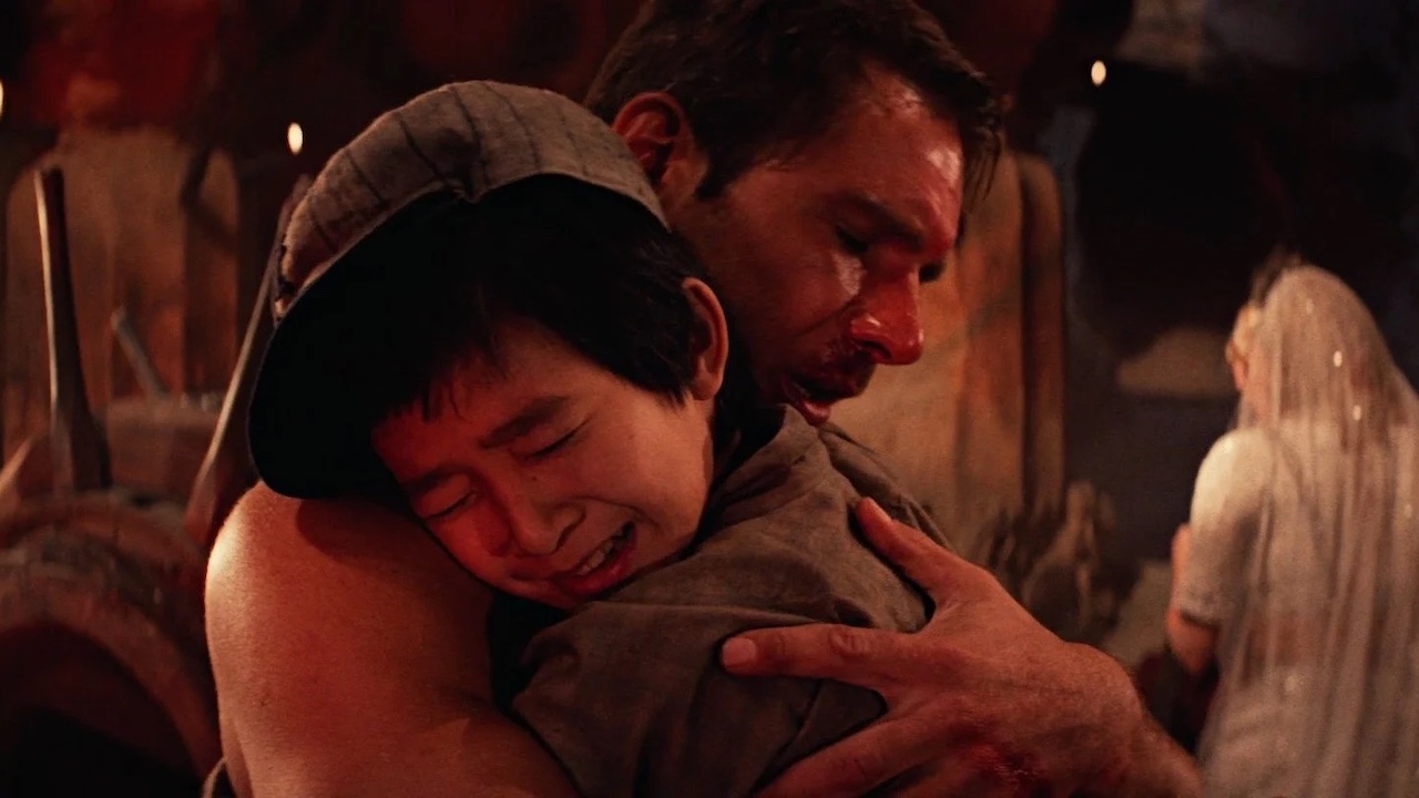 Indiana Jones hugging Short Round in Temple of⁣ Doom