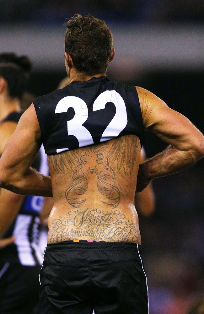 Jordan de goey of the magpies handpasses in a 2021 afl . Darcy Moore wonâ€™t be getting any tattoos after his mum