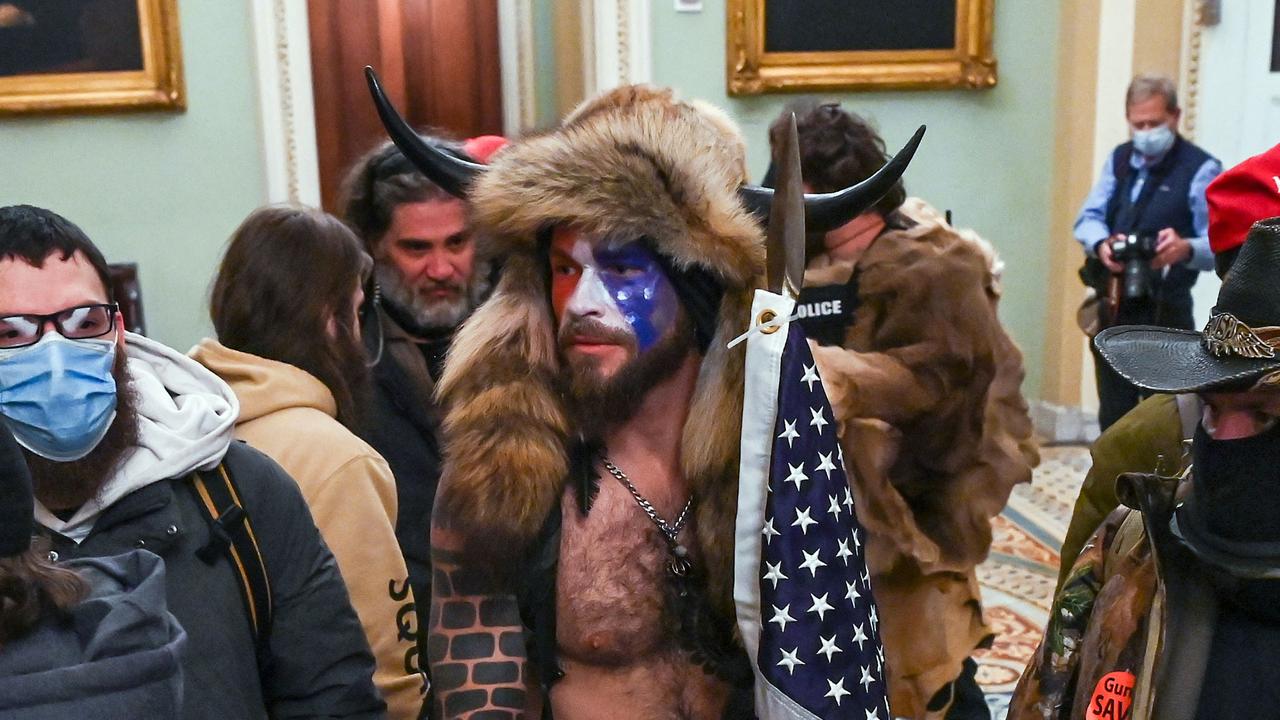 Qanon Shaman Cartoon . Qanon Shaman Who Stormed Capitol Begs For Pardon