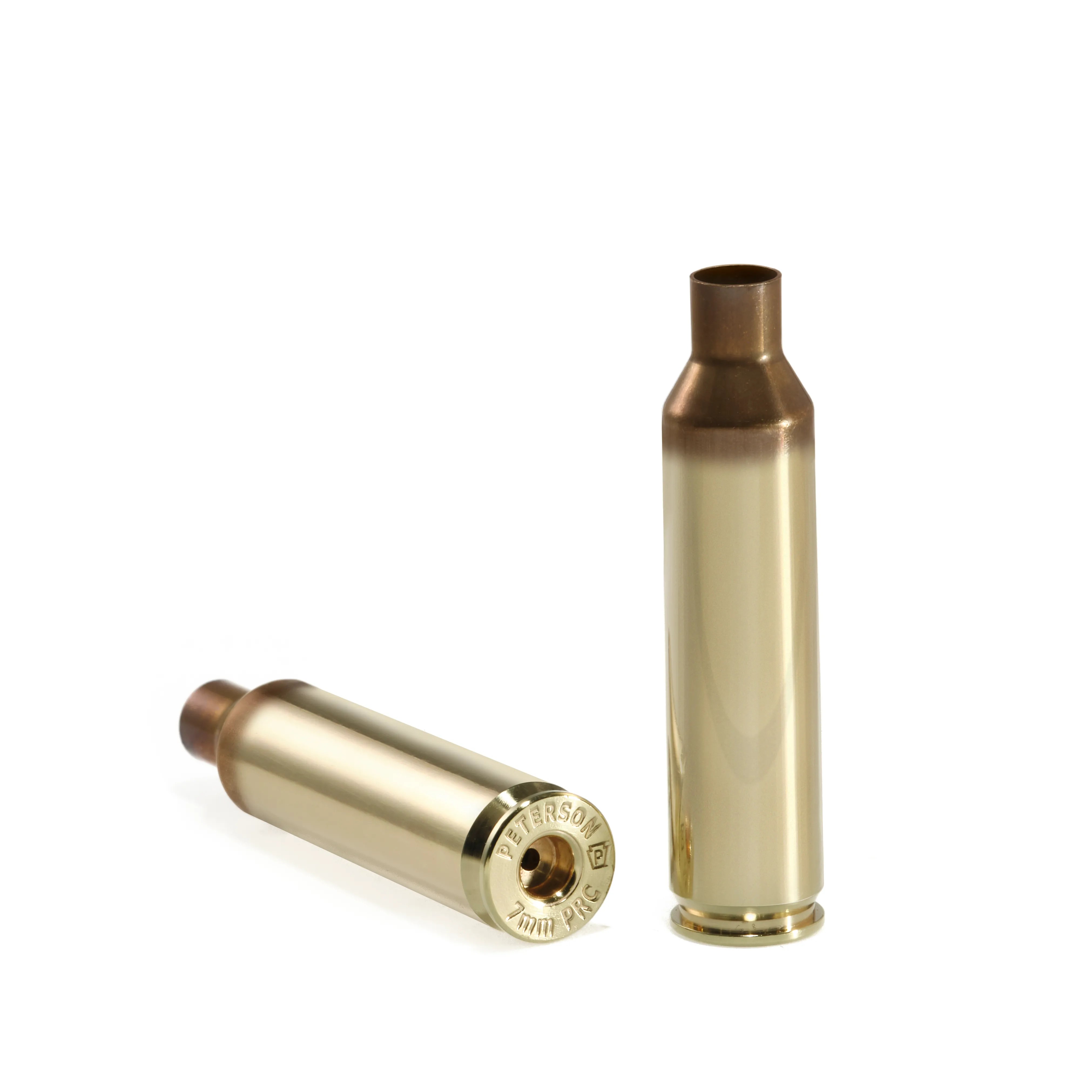 Two polished Peterson 7mm PRC brass cartridge cases for precision reloading