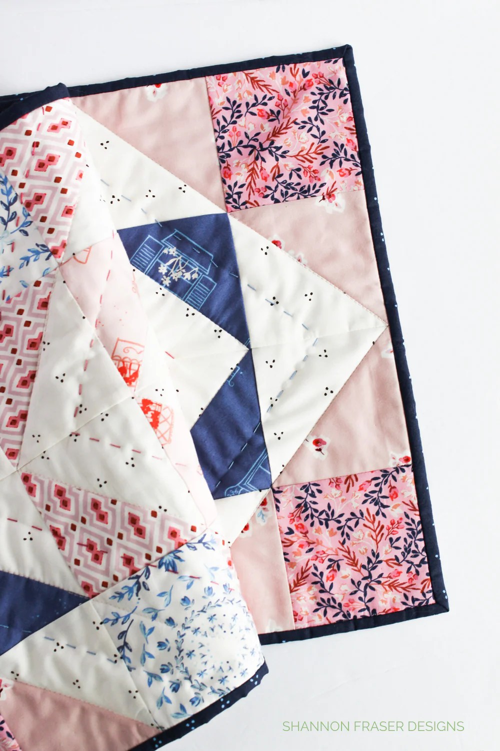 Corner of pink and blue Modern Aztec quilted table runner | Sonata Showcase | Shannon Fraser Designs