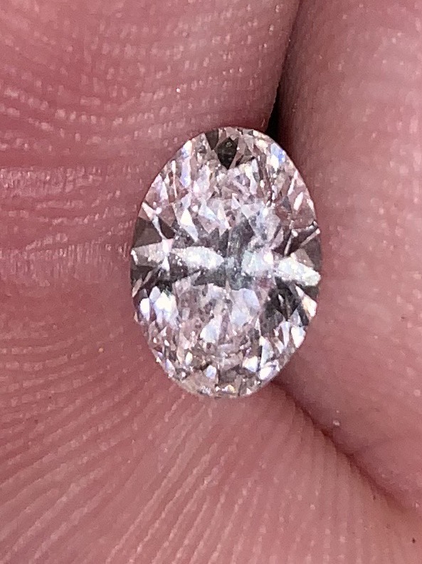 It's the accessory for the fearless and the bold. Opinions on this oval diamond please? Specifically the bow