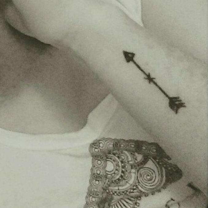 Forearm Tattoo Of An Arrow On Marina.