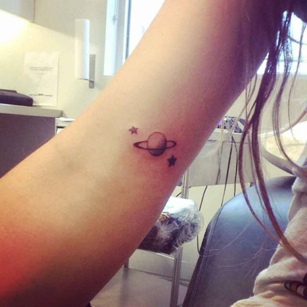 Little Upper Arm Tattoo Of Planet Saturn And Two Stars 1000_x_1000_jpg