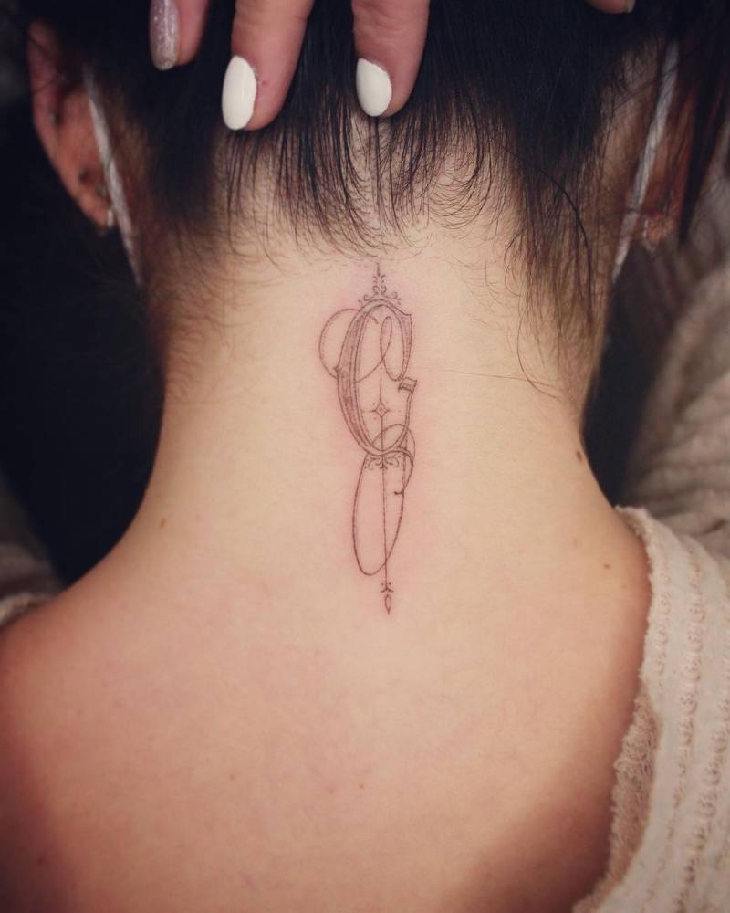 G" Letter Tattooed On The Back Of The Neck