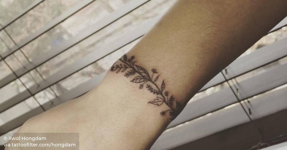 Flower Arm Band Tattoo On The Right Wrist. 628_x_1200_jpg