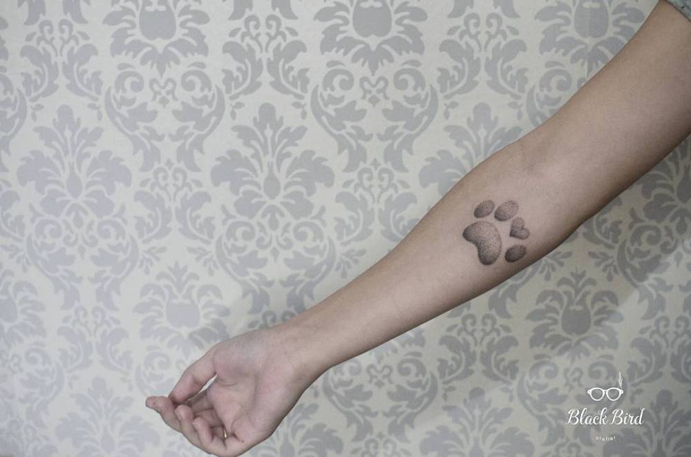 Small Dotwork Style Paw Tattoo On The Right Forearm. 662_x_1000_jpg